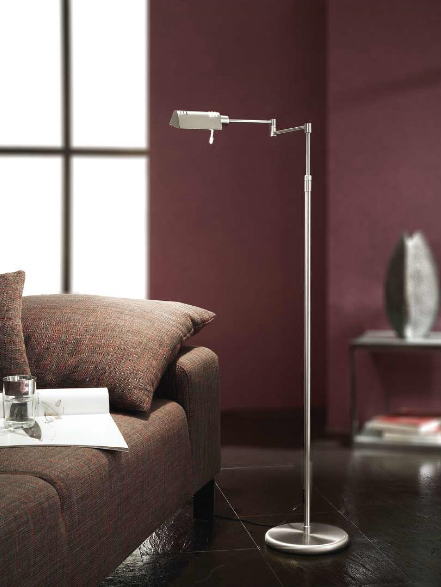 HK9801/8-69, A floor standing lamp, adjustable in height, has a swing arm and an adjustable head. Built in LED with dimmer. This model in shown in Satin Nickel finish.