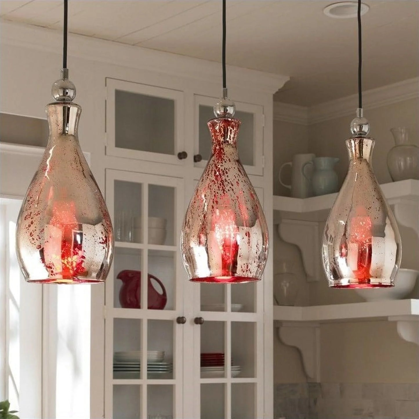 Uttermost Sardinia 21985 Mini Pendant Light. This curved pendant light offers a rich red hue for a touch of sophistication. Red Mercury Glass With Plated Chrome Accents.
